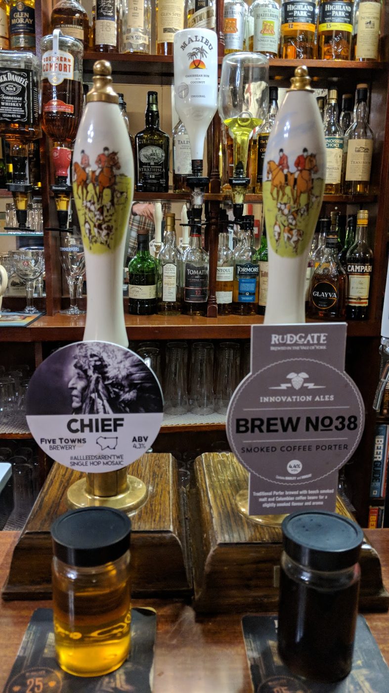 Two hand pumps, Chief and Brew No.38, with tasting glasses